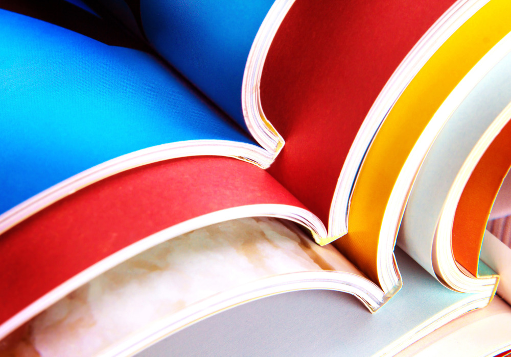 stack of the colourful magazines