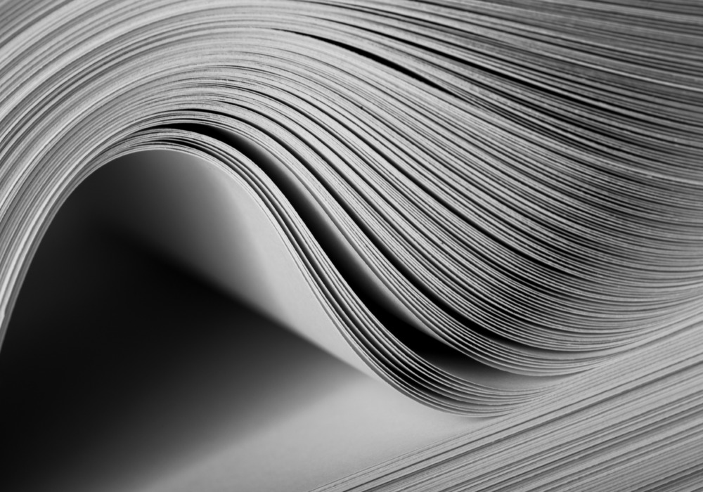 Close-up of a bending stack of paper