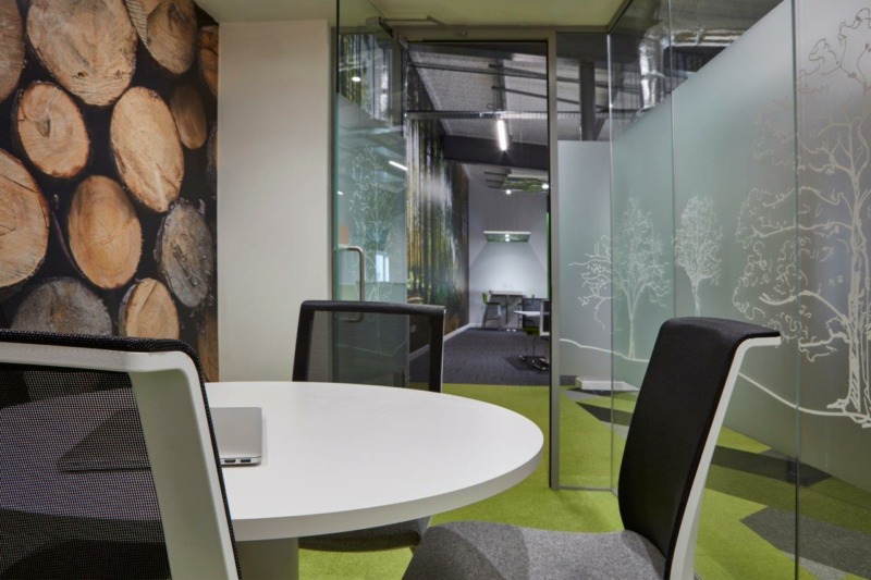 Office table within a series of meeting rooms at Springfield Papers, Bristol.