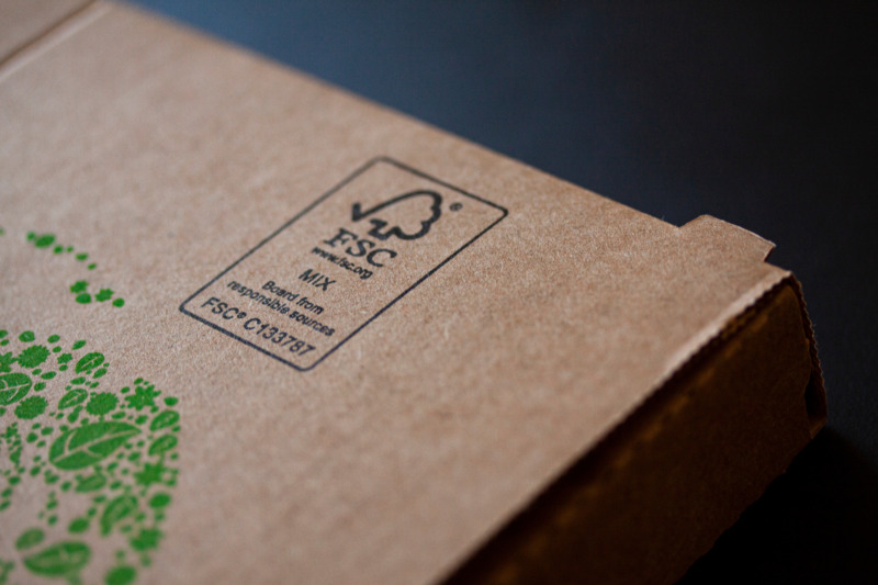 FSC logo printed on sustainable Compostable cardboard pizza box. FSC - The Forest Stewardship Council. Shallow depth of field and selective focus image. Copenhagen, Denmark - april 22, 2022.