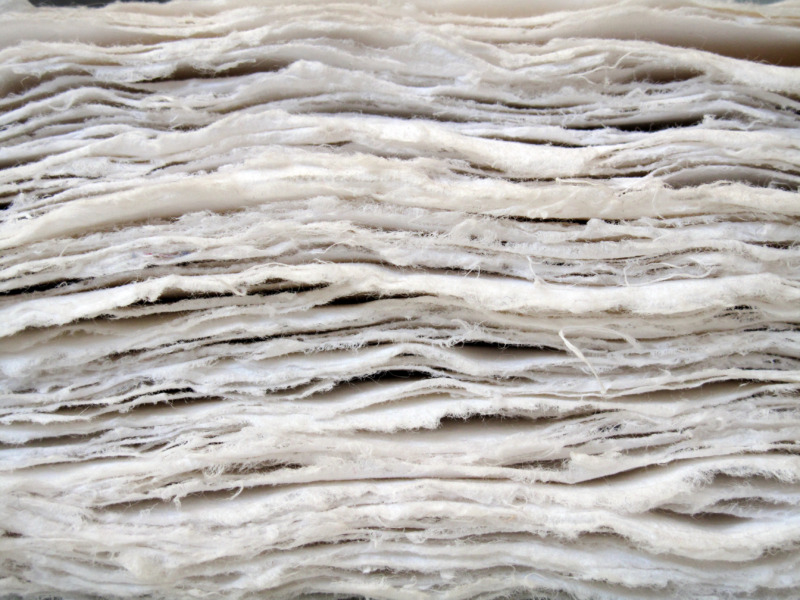 A stack of wet paper pulp, close up.
